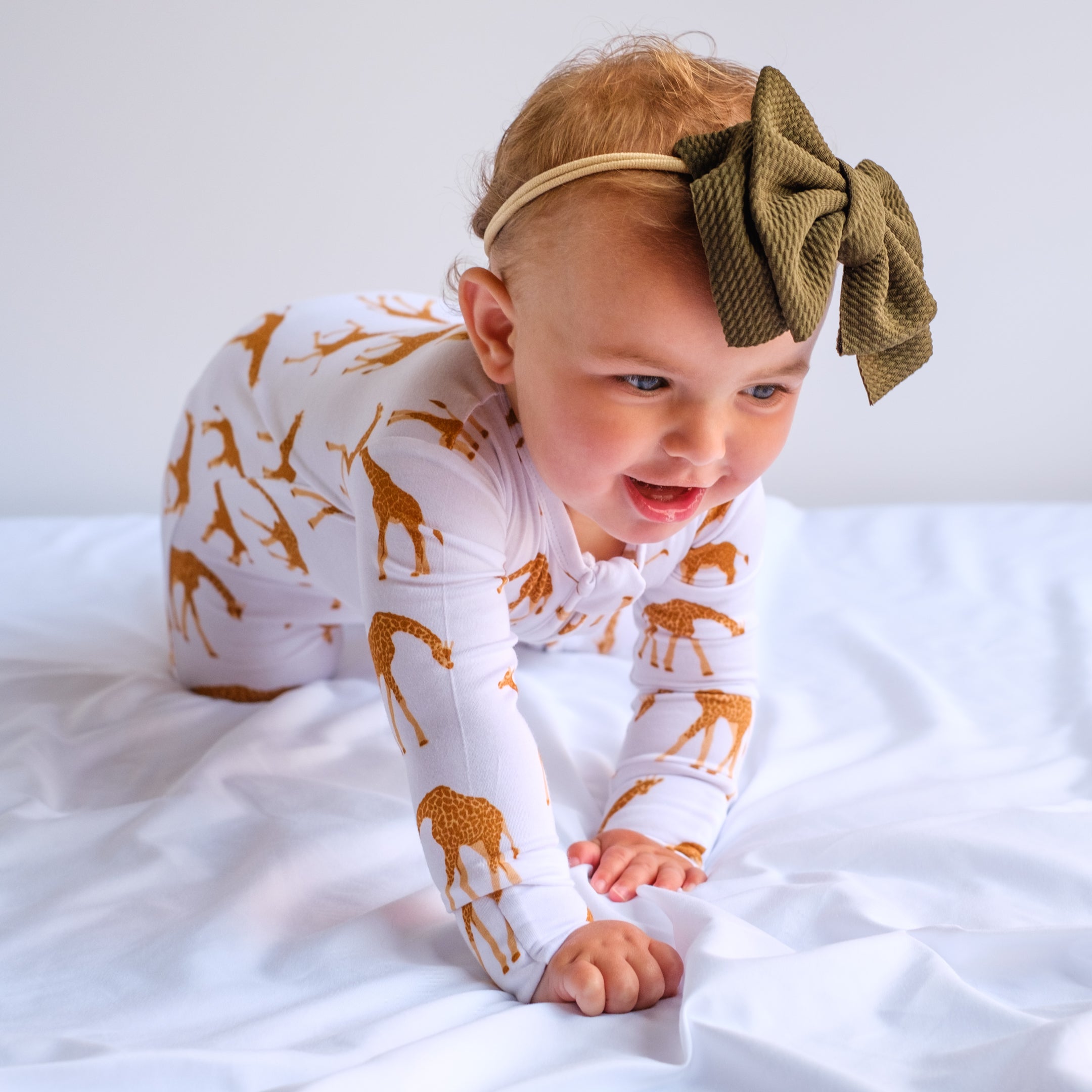 Olive Waffle Bow Headband on happy  baby crawling